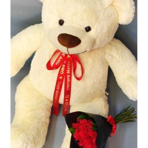 Oso de peluche grande con ramo de flores